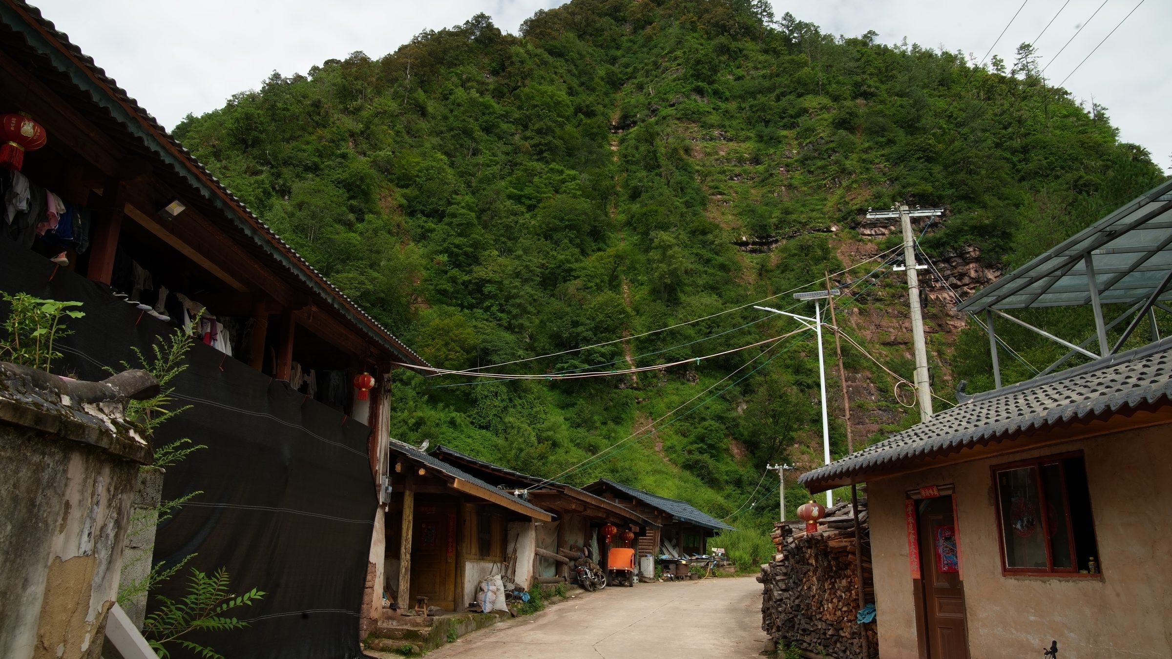 Liju village lane below the forested mountain